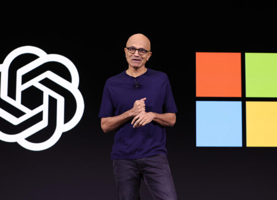 SAN FRANCISCO, CALIFORNIA - NOVEMBER 06: Microsoft CEO Satya Nadella (R) speaks as OpenAI CEO Sam Altman (L) looks on during the OpenAI DevDay event on November 06, 2023 in San Francisco, California. Altman delivered the keynote address at the first ever Open AI DevDay conference. (Photo by Justin Sullivan/Getty Images)