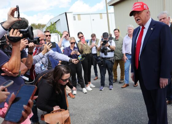 Trump visits Georgia hurricane site, bashes Harris