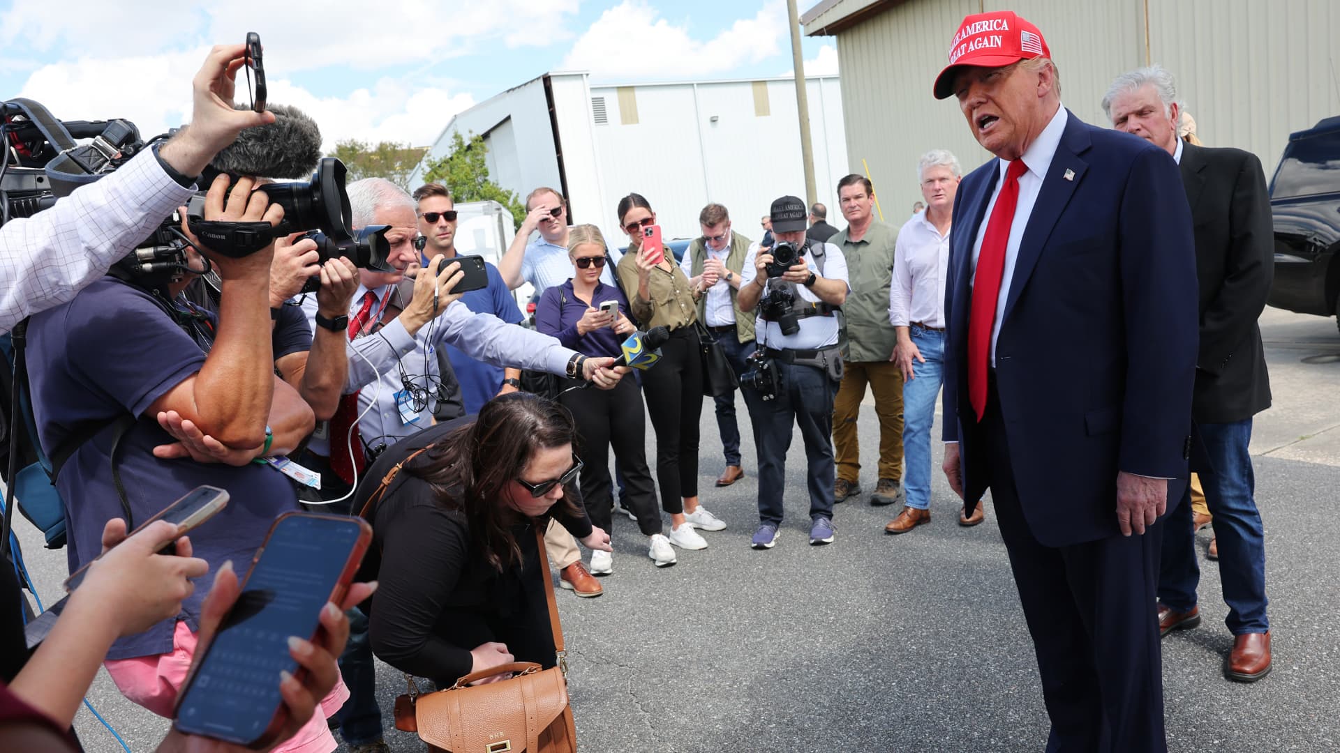 Trump visits Georgia hurricane site, bashes Harris