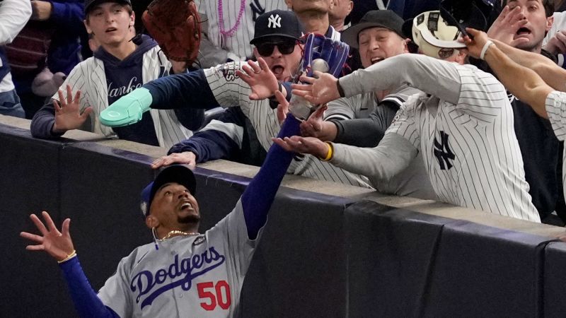 Yankees fans ejected after ripping ball from Mookie Betts’ glove during Game 4 of World Series | CNN