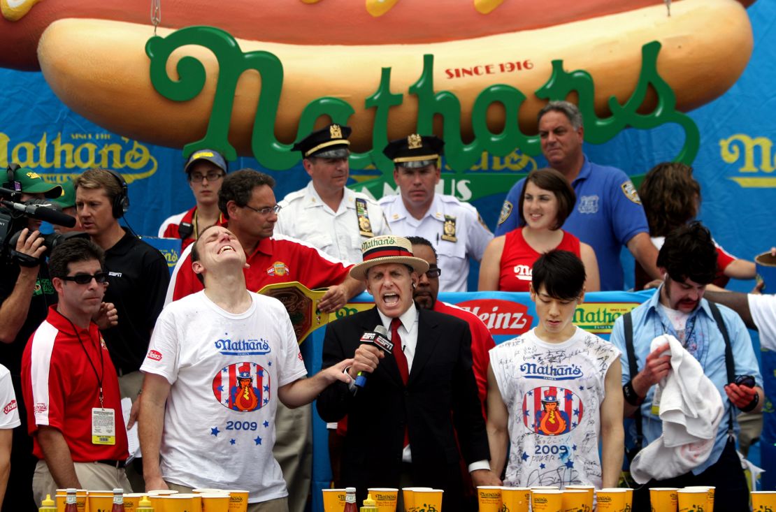 Chestnut (second left) celebrates after beating Kobayashi (second right) at the July 4th Nathan’s Hot Dog Eating Contest in 2009.