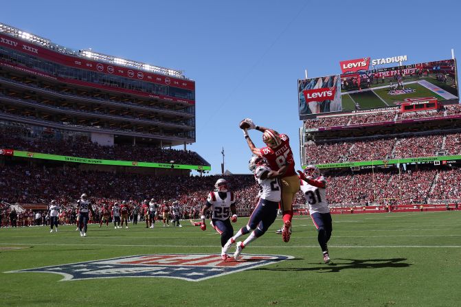 San Francisco 49ers tight end George Kittle catches a touchdown pass in the end zone in Santa Clara, California, on September 29. The 49ers beat the New England Patriots 30-13.