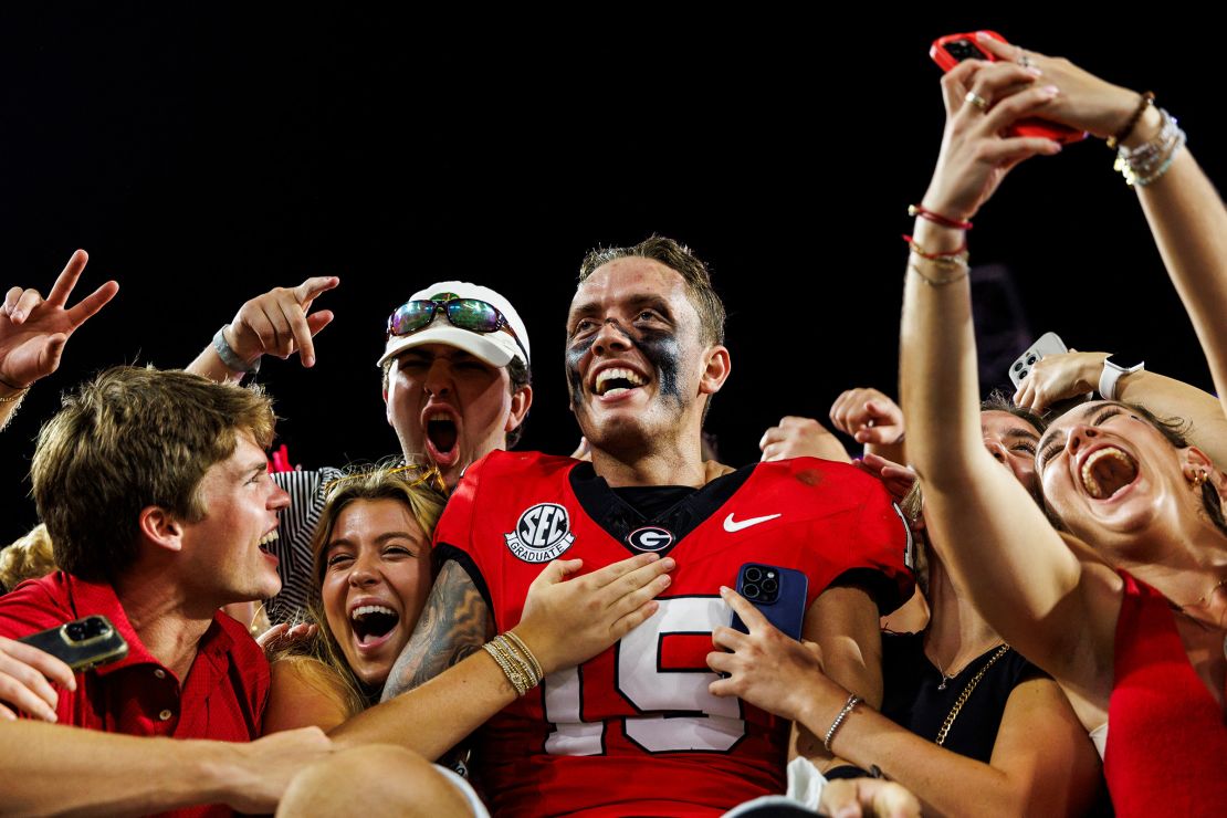 Carson Beck of the Georgia Bulldogs celebrates after defeating the Florida Gators 34-20.