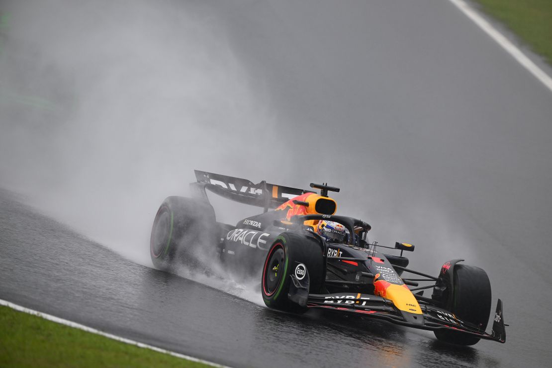 Rain kicks up off the back of Verstappen's car as he competes during the Sao Paulo Grand Prix.