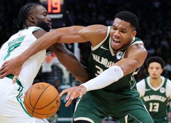 The Milwaukee Bucks' Giannis Antetokounmpo is fouled by the Boston Celtics' Jaylen Brown during the second half.