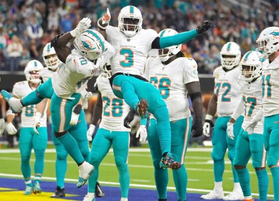 Miami Dolphins linebacker Quinton Bell forces Los Angeles Rams quarterback Matthew Stafford to fumble the ball during the first half of the game.