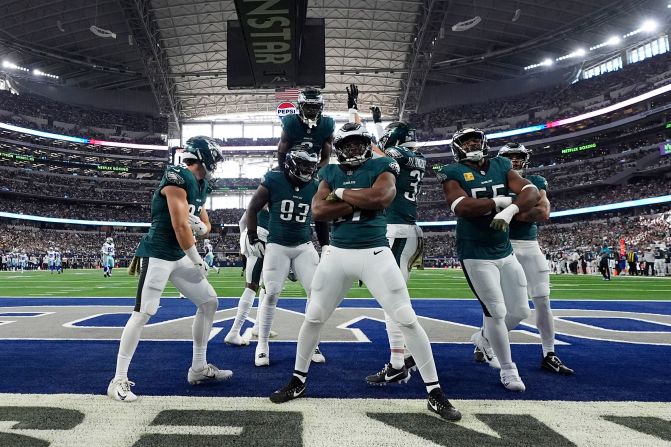 Philadelphia Eagles defensive tackle Milton Williams celebrates with teammates after recovering a Dallas Cowboys fumble in Arlington, Texas, on November 10. The Eagles won 34-6.