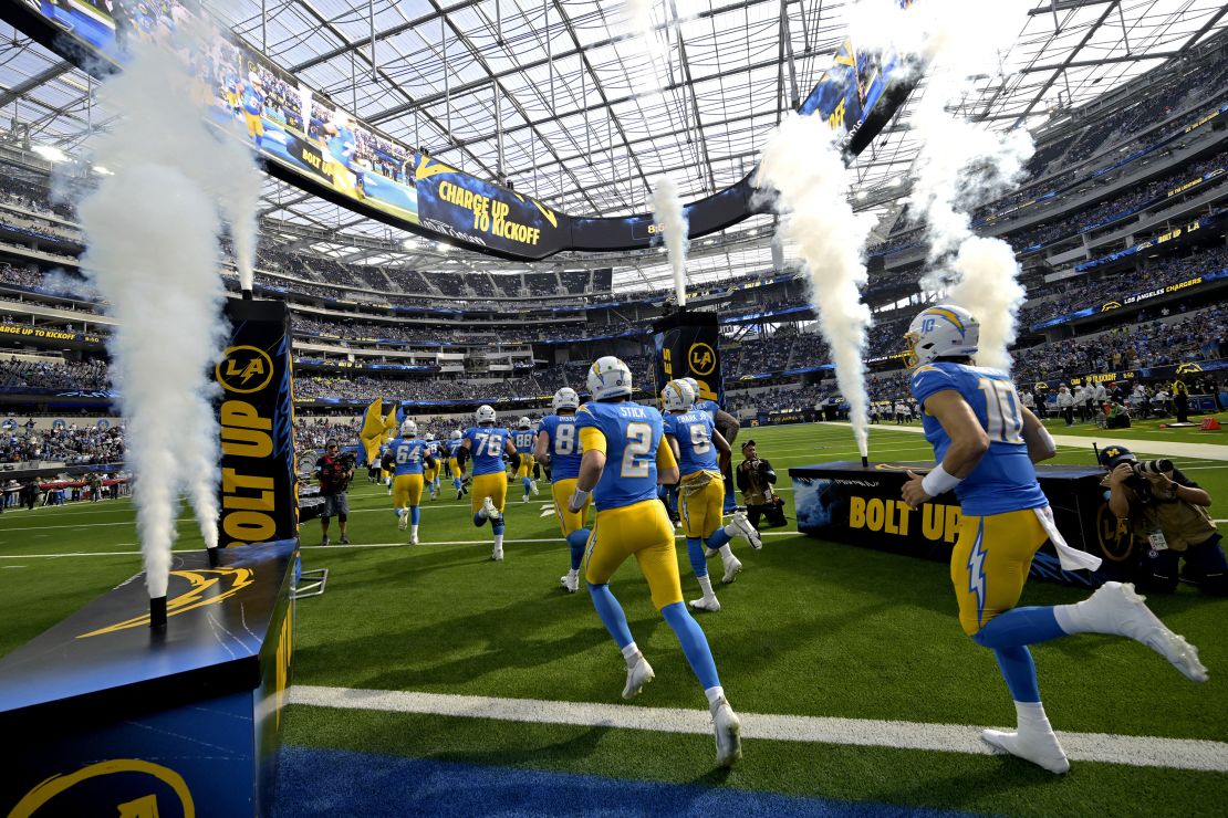 Nov 10, 2024; Inglewood, California, USA; Los Angeles Chargers players run on to the field for the game against the Tennessee Titans at SoFi Stadium. Mandatory Credit: Jayne Kamin-Oncea-Imagn Images