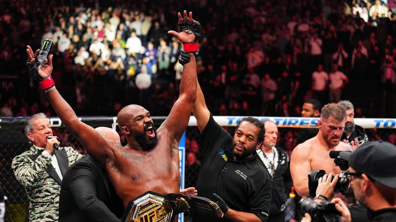 Jon Jones retains UFC heavyweight title with spinning kick to stop Stipe Miocic, celebrates with President-elect Donald Trump | CNN