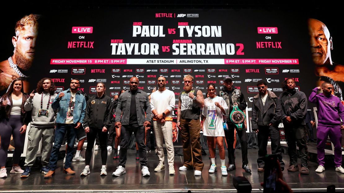 Nakisa Bidarian (center) stands between Tyson and Paul ahead of last week's fight.