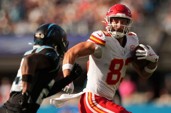 Kansas City Chiefs tight end Noah Gray catches a pass in front of Carolina Panthers safety Xavier Woods in Charlotte, North Carolina, on November 24. The Chiefs won 30-27.