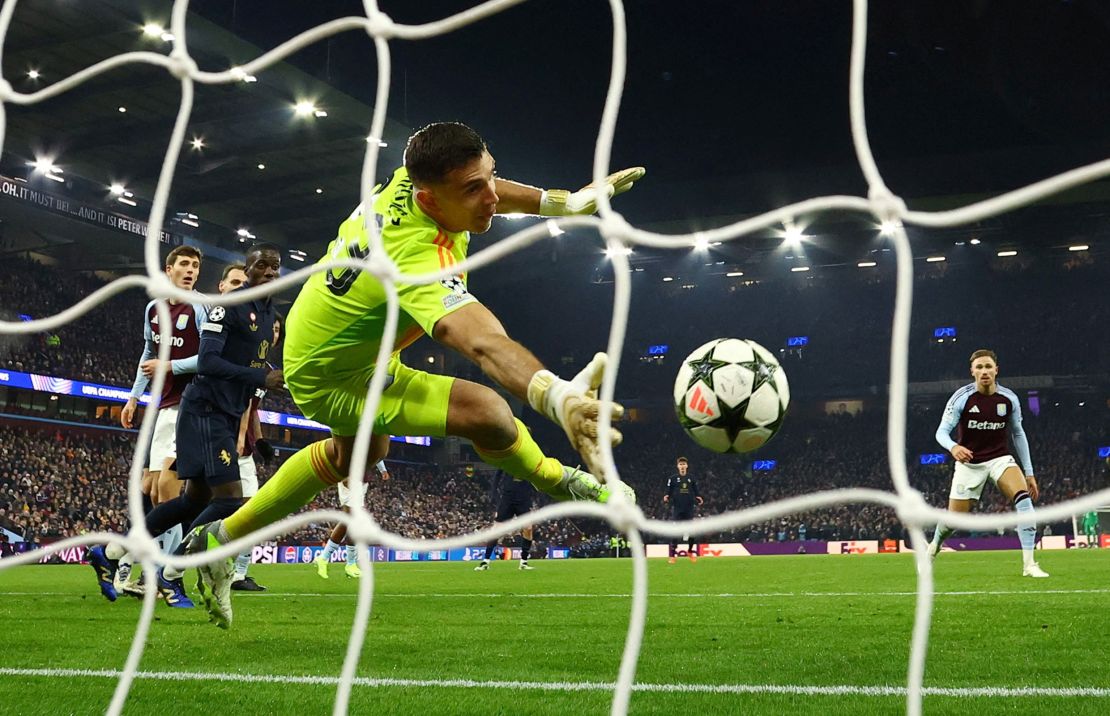 Aston Villa goalkeeper Emiliano Martinez makes a save during the match between Aston Villa and Juventus at Villa Park.