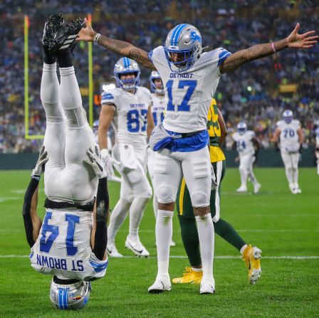 Detroit Lions wide receiver Amon-Ra St. Brown, left, and wide receiver Tim Patrick celebrate after St. Brown caught a touchdown pass during a game against the Green Bay Packers at Lambeau Field in Green Bay, Wisconsin, on November 3. The Lions won 24-14.