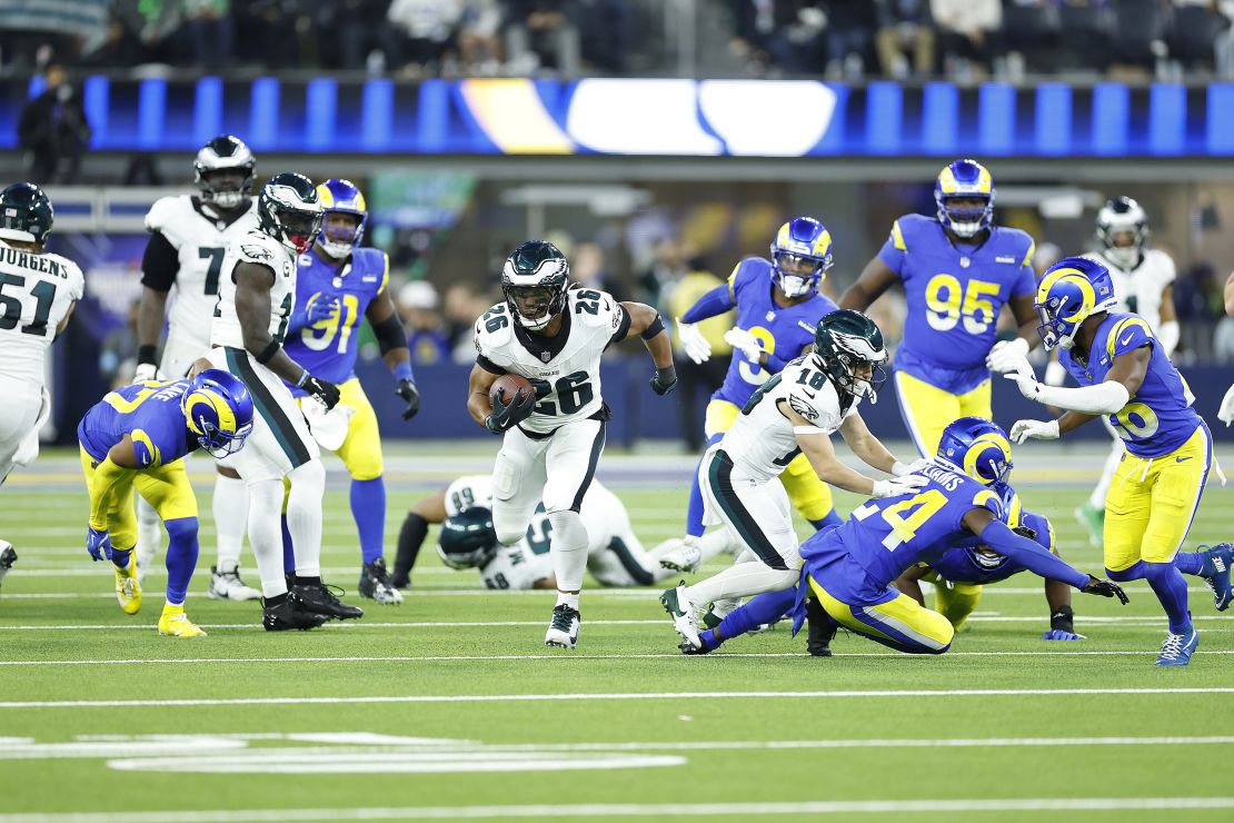 INGLEWOOD, CALIFORNIA - NOVEMBER 24: Saquon Barkley #26 of the Philadelphia Eagles runs for a touchdown during the third quarter against the Los Angeles Rams at SoFi Stadium on November 24, 2024 in Inglewood, California. (Photo by Ronald Martinez/Getty Images)