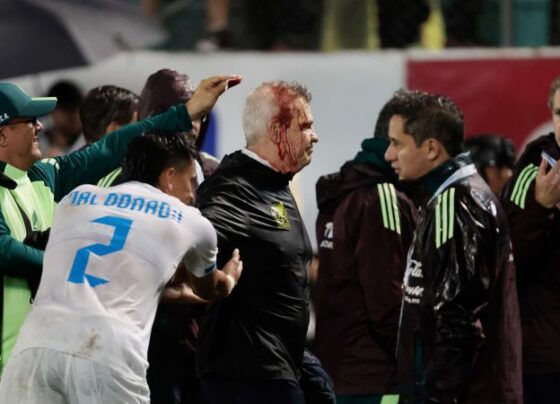 Mexico soccer manager Javier Aguirre struck by can thrown onto the pitch from stands, left with bloodied head | CNN