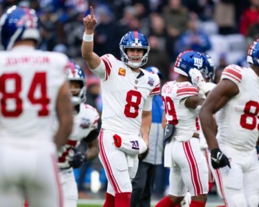 Nov 8, 2024; Munich, Germany; New York Giants quarterback Daniel Jones (8) during press conference at the FC Bayern Munchen training grounds at Sabener Strasse. Mandatory Credit: Kirby Lee-Imagn Images