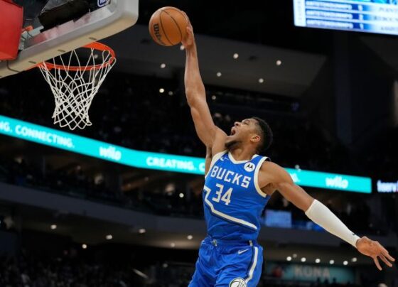 Antetokounmpo drives to the basket against the Wizards' Bilal Coulibaly.