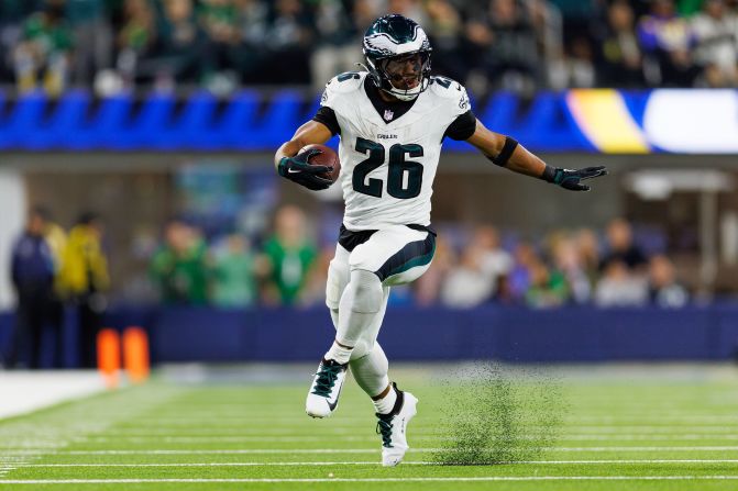 Philadelphia Eagles running back Saquon Barkley carries the ball during the Eagles' 37-20 victory over the Los Angeles Rams at SoFi Stadium in Inglewood, California, on Sunday, November 24. Barkley rushed for an Eagles franchise-record 255 yards on just 26 carries. 255 rushing yards in a game is also the ninth-most ever recorded in a single game by one player.