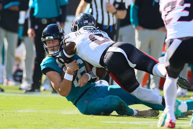 Jacksonville Jaguars quarterback Trevor Lawrence is hit by Houston Texans linebacker Azeez Al-Shaair during their game on December 1 in Jacksonville, Florida. Lawrence was ruled out with a concussion after taking the late hit. Al-Shaair was ejected from the game along with Jaguars cornerback Jarrian Jones for an ensuing fight.