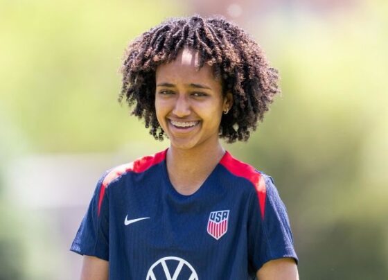 Lily Yohannes holding a trophy she won playing for Loudoun County FC's under-12 team.