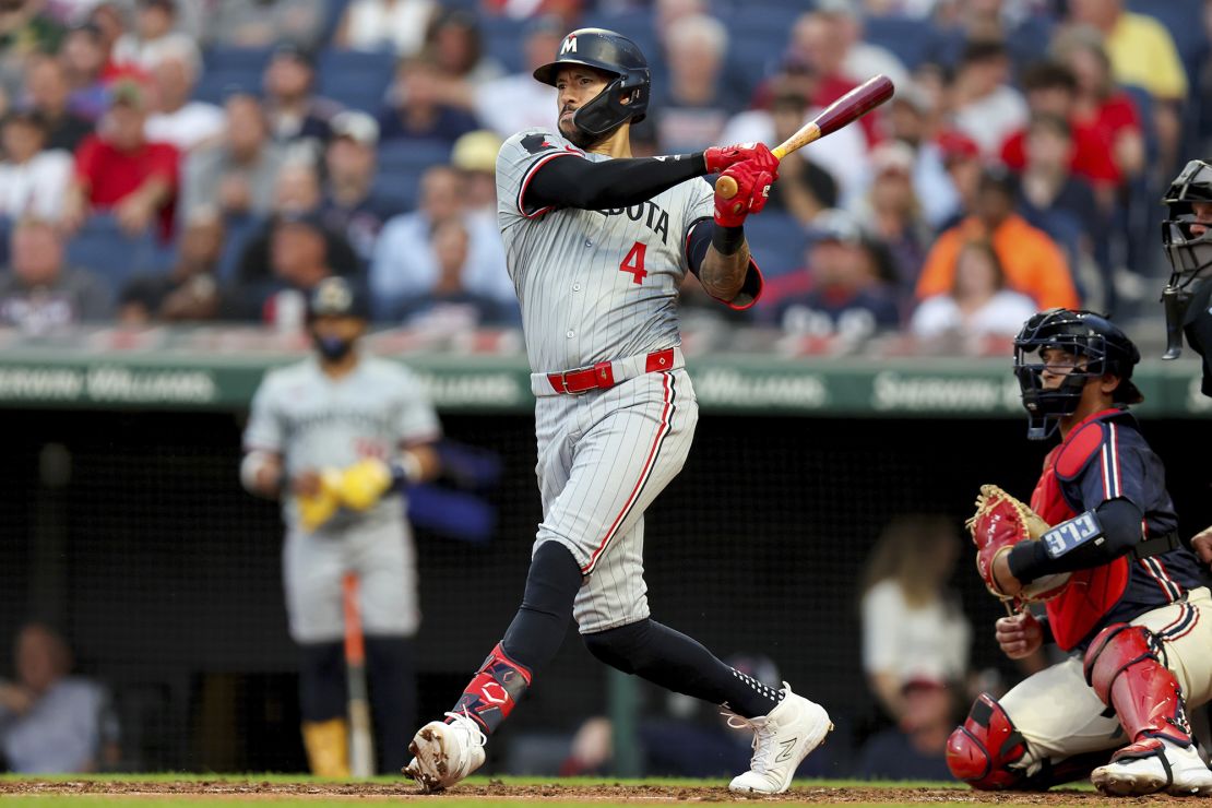 Minnesota Twins shortstop Carlos Correa hits a single against the Cleveland Guardians on September 18.