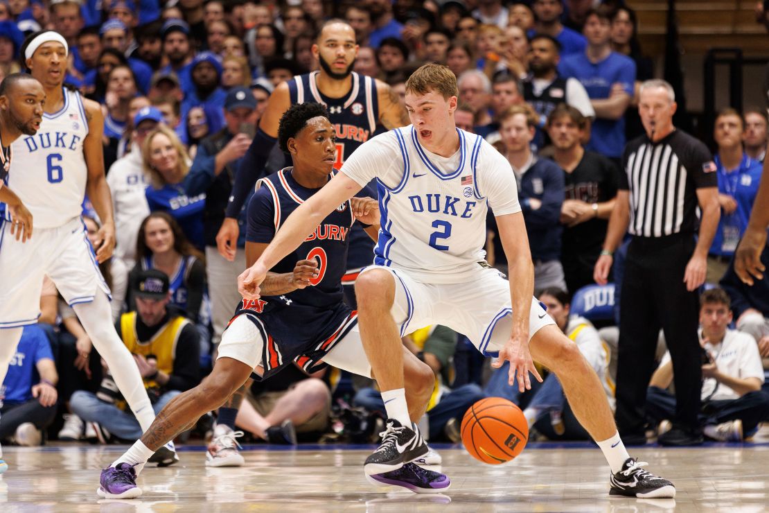 Duke's Cooper Flagg handles the ball as Auburn's Tahaad Pettiford defends at the Cameron Indoor Stadium.