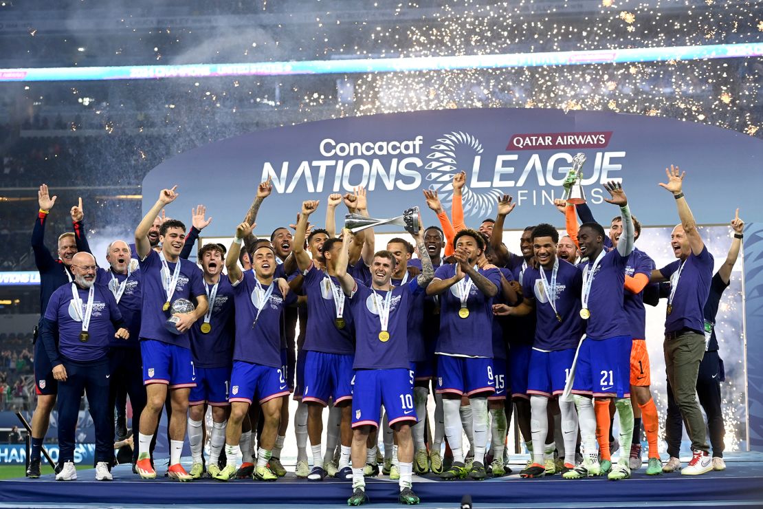 The USMNT celebrates with the trophy after winning the Concacaf Nations League final match against Mexico at AT&T Stadium on March 24.