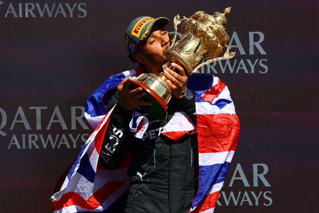 Hamilton celebrates on the podium at Silverstone after winning his first race in well over two years.