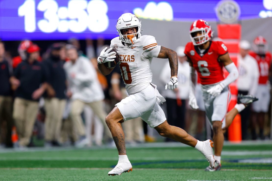 Texas Longhorns' DeAndre Moore Jr. (No. 0) scores against the Georgia Bulldogs in the SEC Championship.