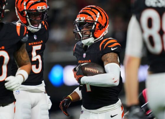 Cincinnati Bengals running back Chase Brown jumped into the Salvation Army kettle after a touchdown catch against the Dallas Cowboys.