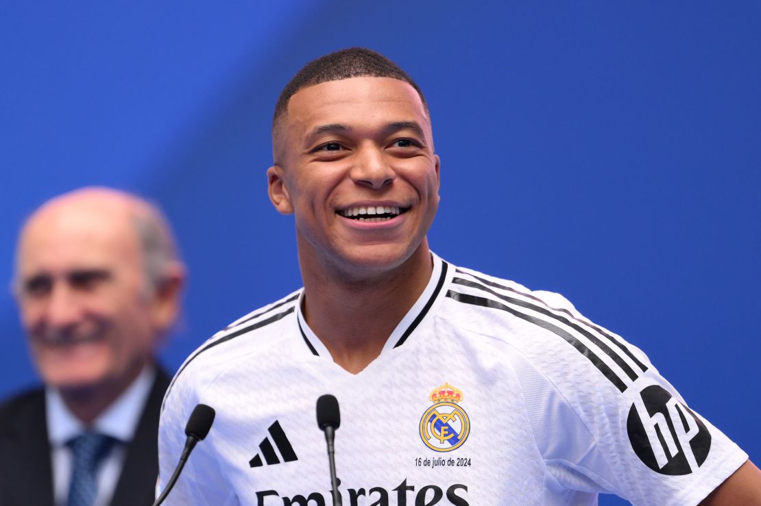 Mbappé smiles as he is introduced to the crowd at Bernabéu in Madrid on July 16.