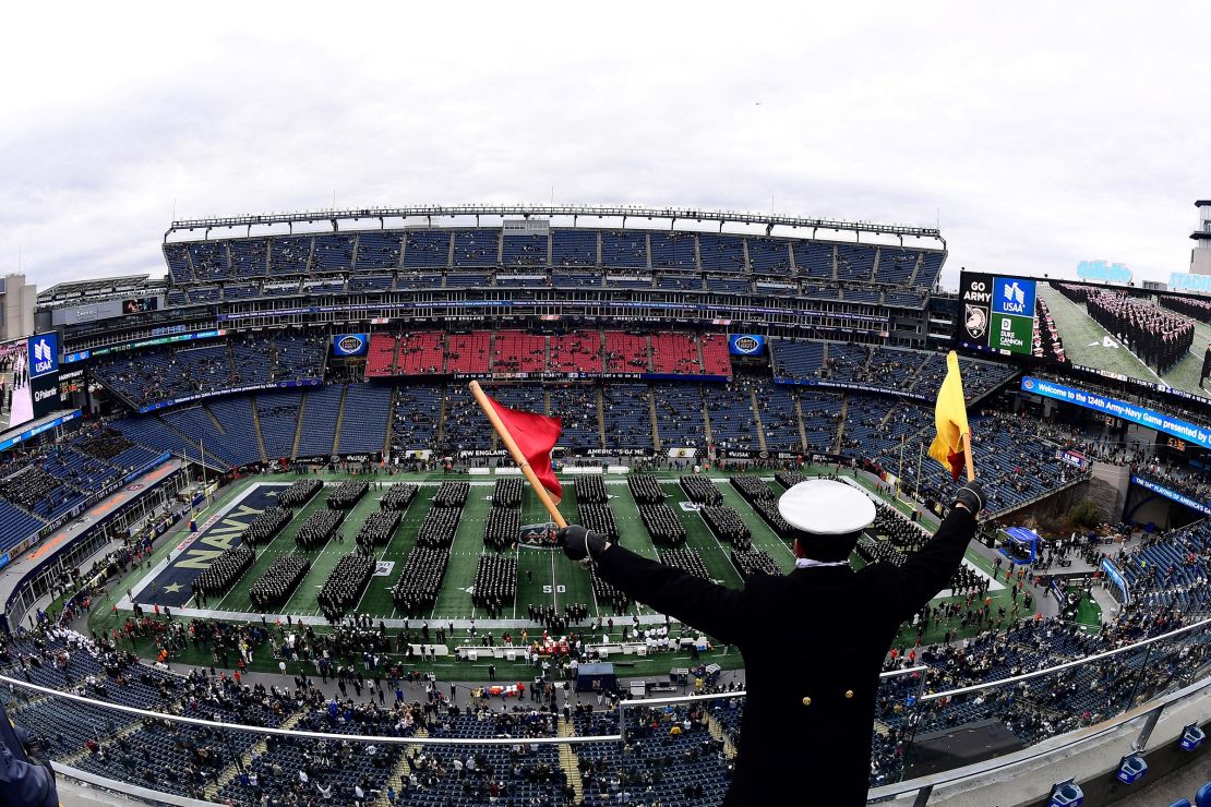 The Brigade of Midshipmen from the United States Naval Academy walk on to the field before the Army-Navy Game at Gillette Stadium in Massachusetts in 2023.