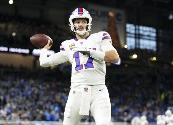 DETROIT, MICHIGAN - DECEMBER 15: Josh Allen #17 of the Buffalo Bills runs with the ball while being chased by Josh Paschal #93 of the Detroit Lions in the third quarter at Ford Field on December 15, 2024 in Detroit, Michigan. (Photo by Nic Antaya/Getty Images)