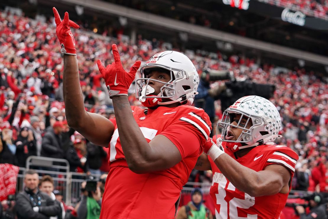 Jelani Thurman and TreVeyon Henderson of the Ohio State Buckeyes celebrate after Thurman scored a touchdown in the third quarter against the Indiana Hoosiers at Ohio Stadium on November 23.