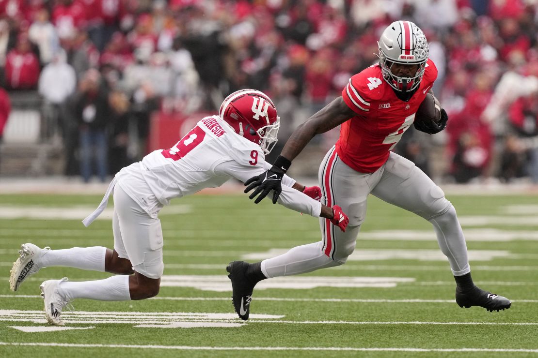 Ohio State's Jeremiah Smith (No. 4) looks to evade a tackle during a game versus Indiana last month.