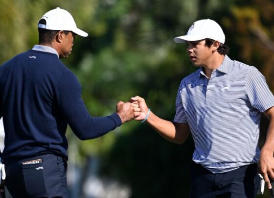 Tiger Woods and son Charlie Woods warm up on Friday ahead of the PNC Championship.