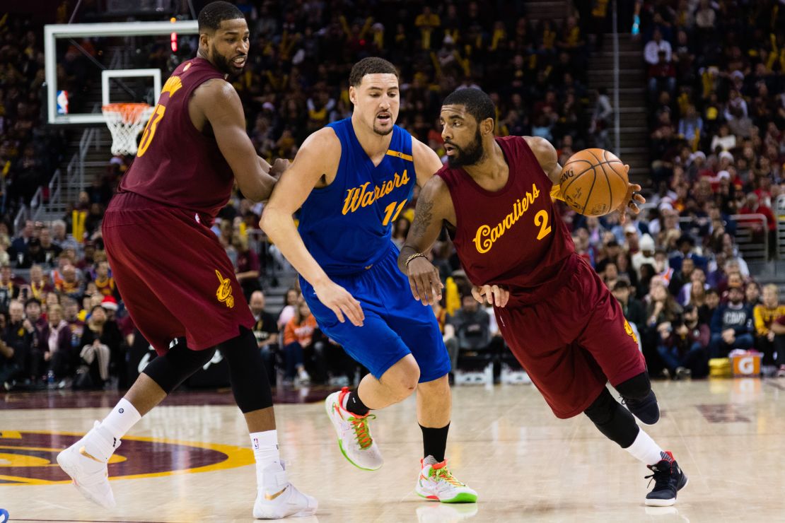 CLEVELAND, OH - DECEMBER 25: Tristan Thompson #13 sets a pick as Kyrie Irving #2 of the Cleveland Cavaliers drives around Klay Thompson #11 of the Golden State Warriors during the second half at Quicken Loans Arena on December 25, 2016 in Cleveland, Ohio. The Cavaliers defeated the Warriors 109-108. NOTE TO USER: User expressly acknowledges and agrees that, by downloading and/or using this photograph, user is consenting to the terms and conditions of the Getty Images License Agreement. Mandatory copyright notice. (Photo by Jason Miller/Getty Images)