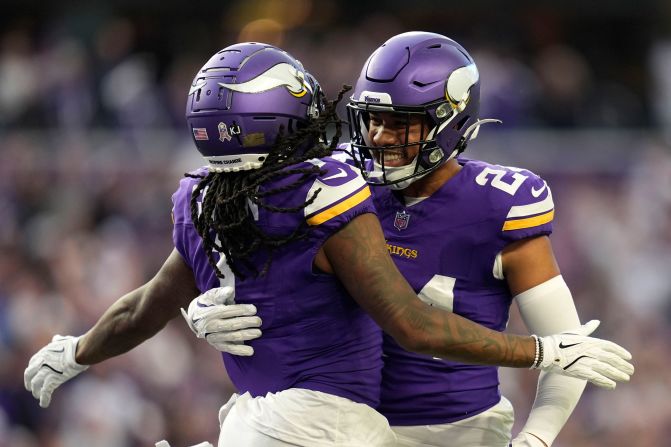 Minnesota Vikings cornerback Shaquill Griffin celebrates with safety Camryn Bynum after intercepting a pass during their team's 23-22 victory over the Arizona Cardinals in Minneapolis on December 1.