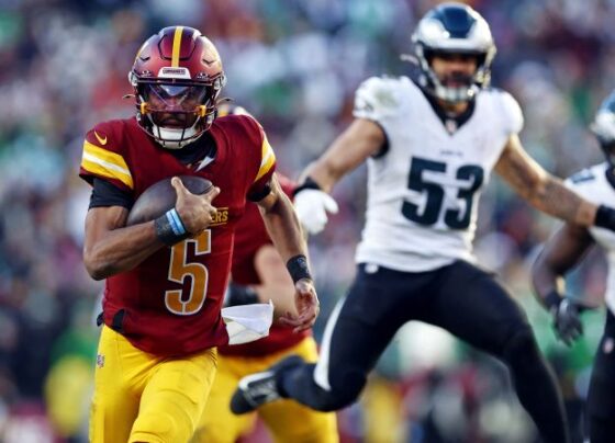 LANDOVER, MD - DECEMBER 22: Philadelphia Eagles quarterback Jalen Hurts (1) is knocked out of the game on a tackle by Washington Commanders linebacker Bobby Wagner, top and Commanders linebacker Frankie Luvu at the Northwest Stadium in Landover, MD on December 22, 2024. (Photo by John McDonnell/ for The Washington Post via Getty Images)