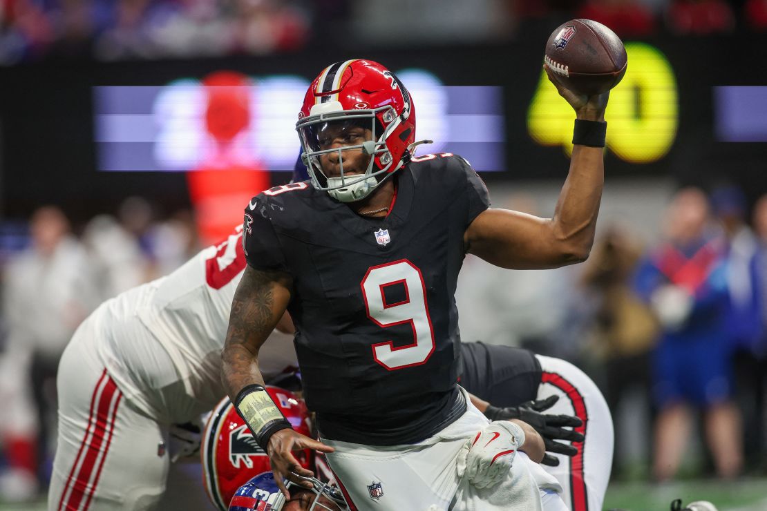 Dec 22, 2024; Atlanta, Georgia, USA; Atlanta Falcons quarterback Michael Penix Jr. (9) avoids the sack of New York Giants linebacker Darius Muasau (53) in the second quarter at Mercedes-Benz Stadium. Mandatory Credit: Brett Davis-Imagn Images