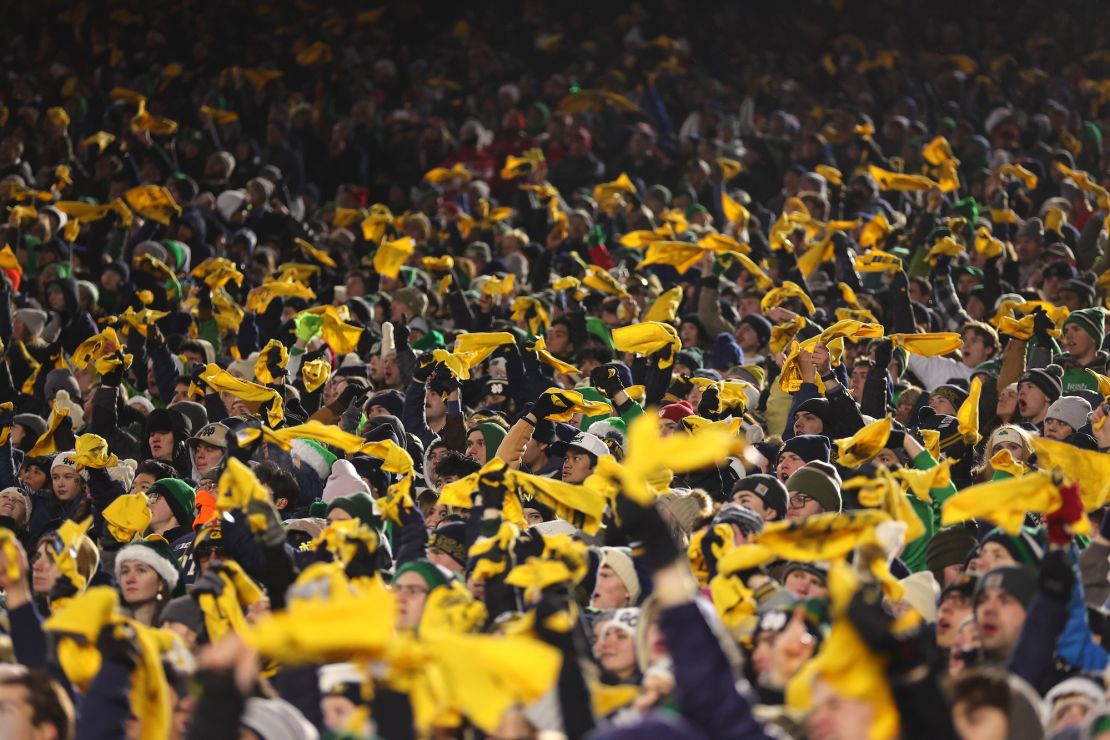 Notre Dame Fighting Irish fans wave towels during the second quarter against the Indiana Hoosiers in the Playoff First Round game at Notre Dame Stadium.