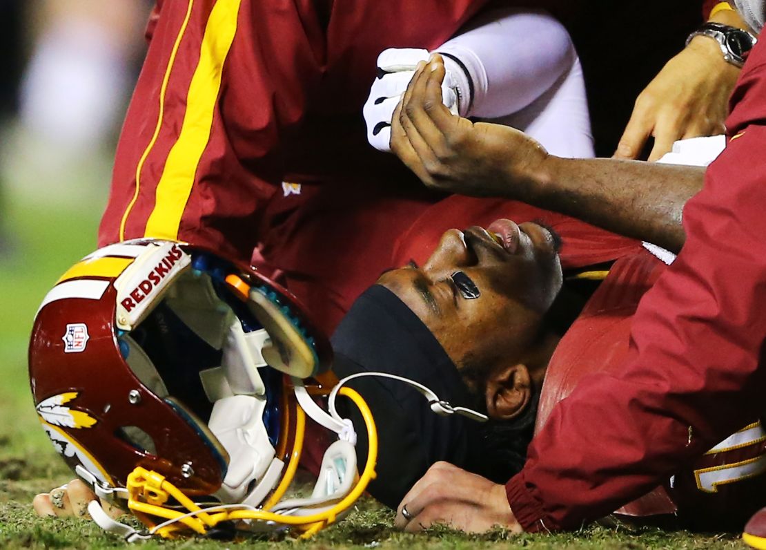 The Washington Redskins' Robert Griffin III lies injured in the fourth quarter against the Seahawks. 