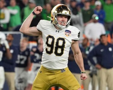 Notre Dame quarterback Riley Leonard (13) scores a touchdown during the second half of the Orange Bowl NCAA College Football Playoff semifinal game against Penn State.