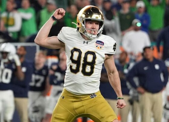 Notre Dame quarterback Riley Leonard (13) scores a touchdown during the second half of the Orange Bowl NCAA College Football Playoff semifinal game against Penn State.