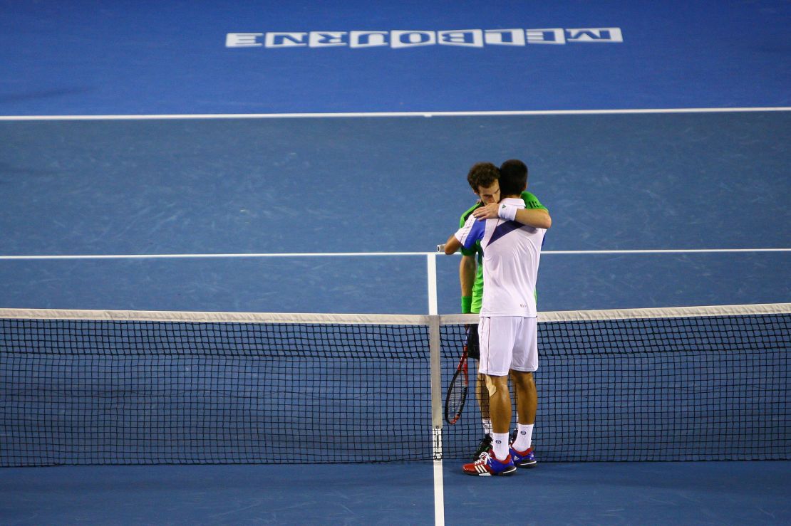 Murray and Djokovic embrace after the 2011 Australian Open final.