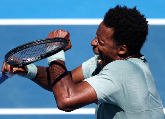 Gaël Monfils serves against Zizou Bergs during their final.