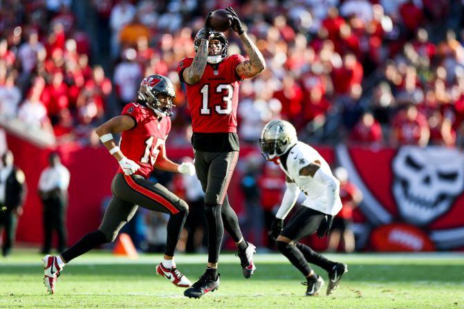 Tampa Bay Buccaneers wide receiver Mike Evans catches a pass in Tampa, Florida, on January 5. With the catch, Mike Evans extended his streak of 1,000-yards in a season for the 11th in a row to tie Pro Football Hall of Famer Jerry Rice for the most ever consecutively. The Buccaneers beat the New Orleans Saints 27-19 and clinched playoff berth.