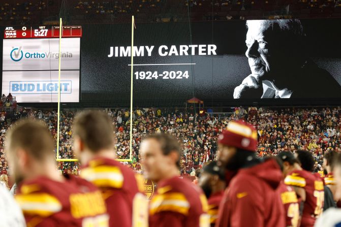 A moment of silence is held for former President Jimmy Carter before the Washington Commanders hosted the Atlanta Falcons on December 29. Carter, the 39th president, died earlier that day at the age of 100.