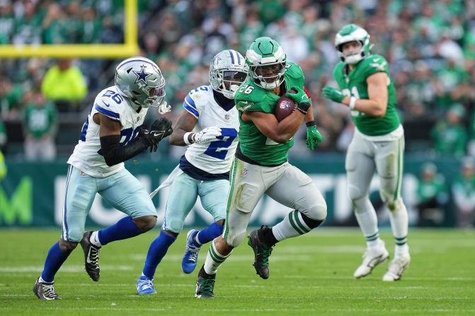 Philadelphia Eagles running back Saquon Barkley carries the ball in Philadelphia on Sunday, December 29. Barkley became just the ninth player in NFL history to rush for 2,000 yards in a single<strong> </strong>season. The Eagles also clinched the NFC East division crown with their 41-7 victory over the Dallas Cowboys.” class=”image__dam-img image__dam-img–loading” onload=’this.classList.remove(‘image__dam-img–loading’)’ onerror=”imageLoadError(this)” height=”2000″ width=”3000″ loading=’lazy’/></source></source></source></source></picture>
    </div>
</div>
<div data-uri=