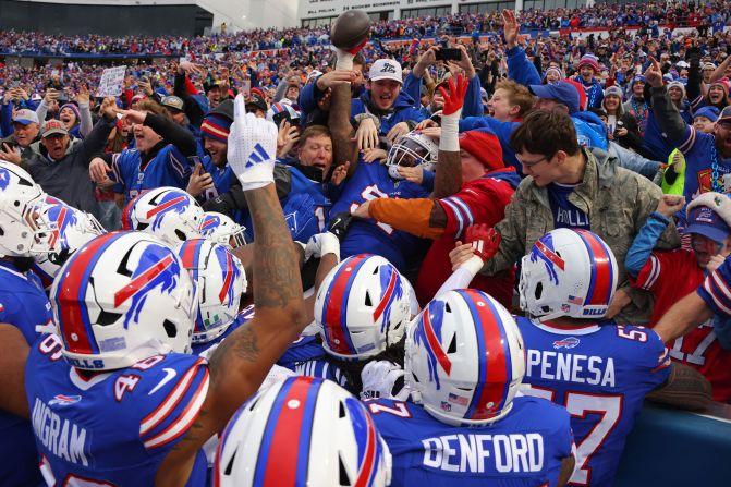 Buffalo Bills defensive tackle Jordan Phillips celebrates with fans after a second quarter interception during his teams' 40-14 win against the New York Jets in Orchard Park, New York, on December 29.